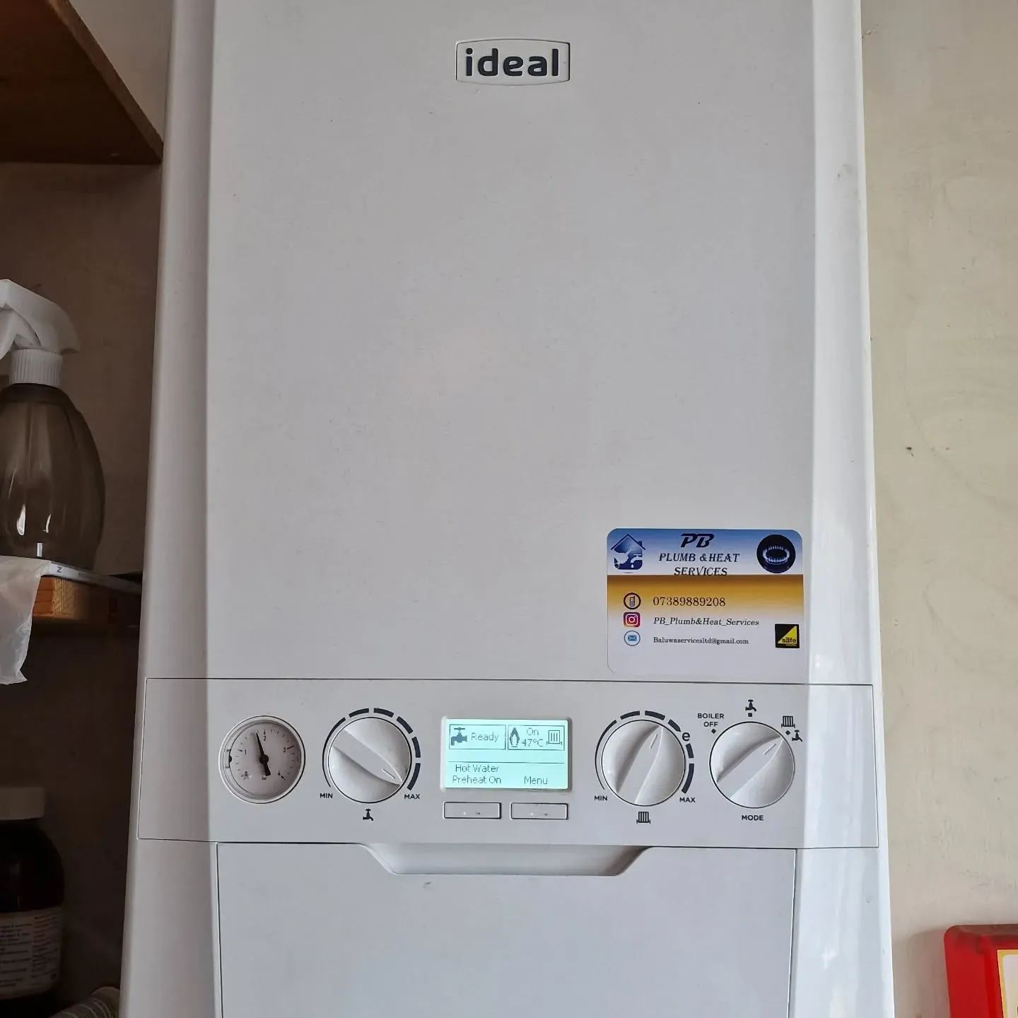 A close up of a tank type water heater.